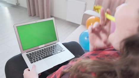 the girl congratulates her friend on his birthday online. video communication.