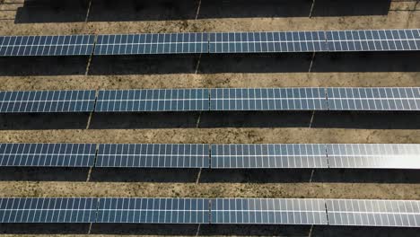 close up of the solar panels in the desert, aerial view