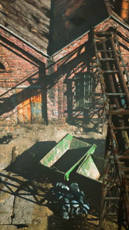 abandoned factory with rusty pipes and a trolley