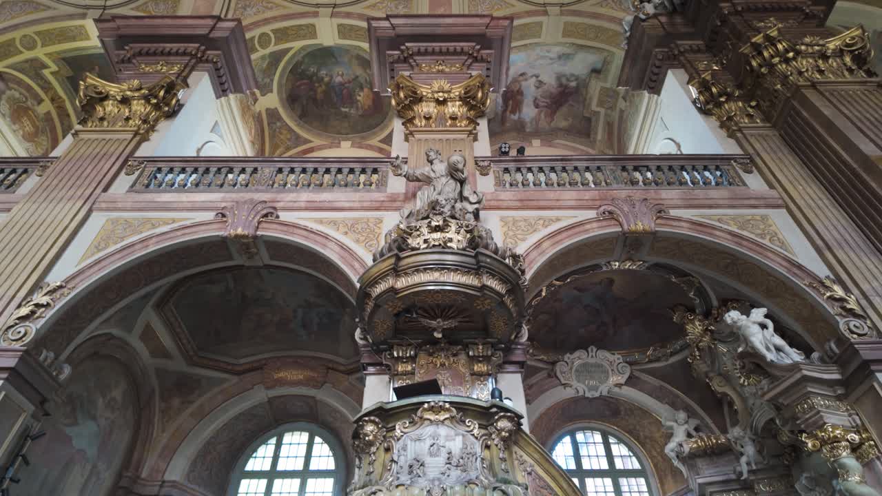 Interior view of Wroclaw's University Church with ornate Baroque architecture and vaulted ceiling