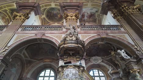 interior view of wroclaw's university church with ornate baroque architecture and vaulted ceiling