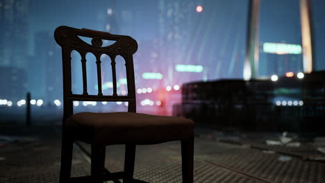 a lone chair sits on a city street at night