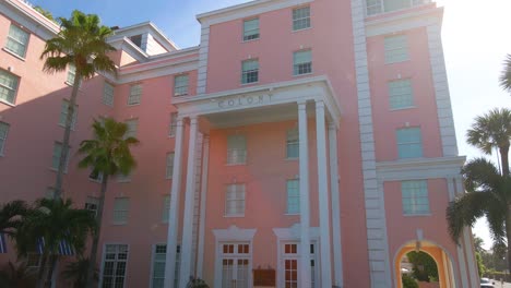 aerial view rising in front of the colony resort, the pinkest boutique hotel in palm beach, miami, florida, usa - tilt, drone shot