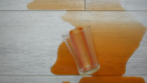 spilled orange juice on a tile floor