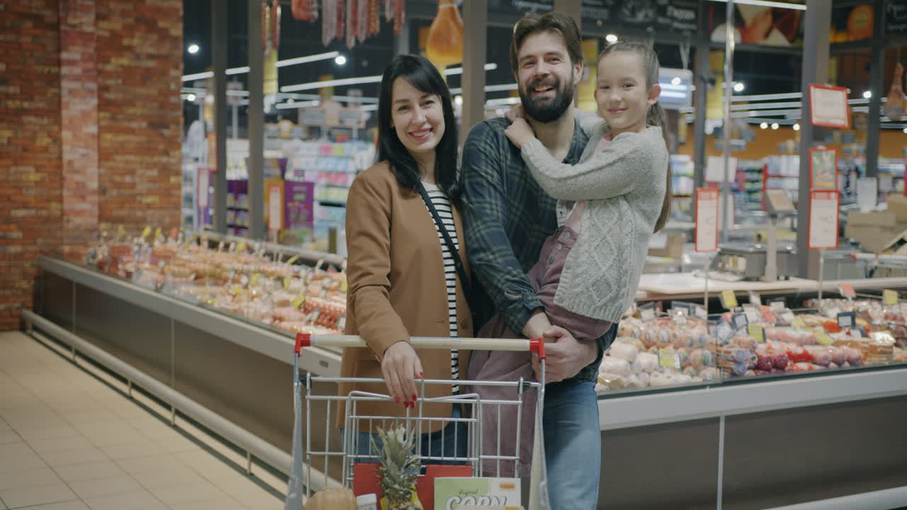 Happy Family Shopping at the Grocery Store