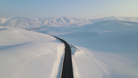 the road through the snowy mountains