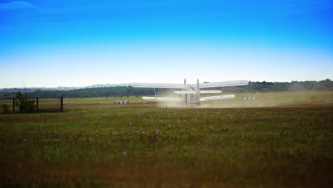 vintage biplane landing on a grass field