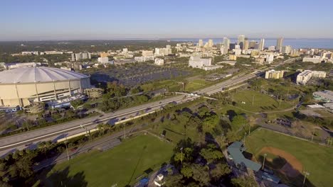 4k aerial drone video of interstate next to domed stadium of tampa bay devil rays in downtown st