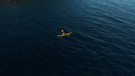 kayaking - man on kayak paddling in the water of adriatic sea near pula, istria, croatia