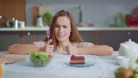 woman eating cake at home