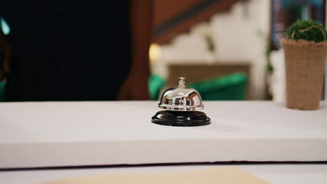 male tourist ringing service bell