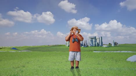 asian boy with a hat and binoculars looking at smartphone then saying wow. boy researcher examines something while traveling in stonehenge, travel tourism adventure concept, full body