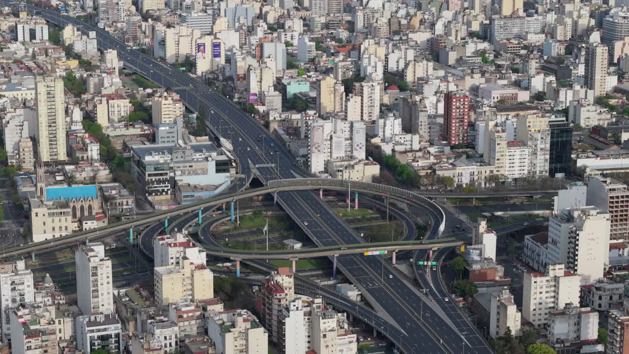 Aerial of a complex urban highway 25 de mayo and 9 de julio avenue interchange showcasing urban infrastructure and bustling city life from above in busy buenos aires argentina