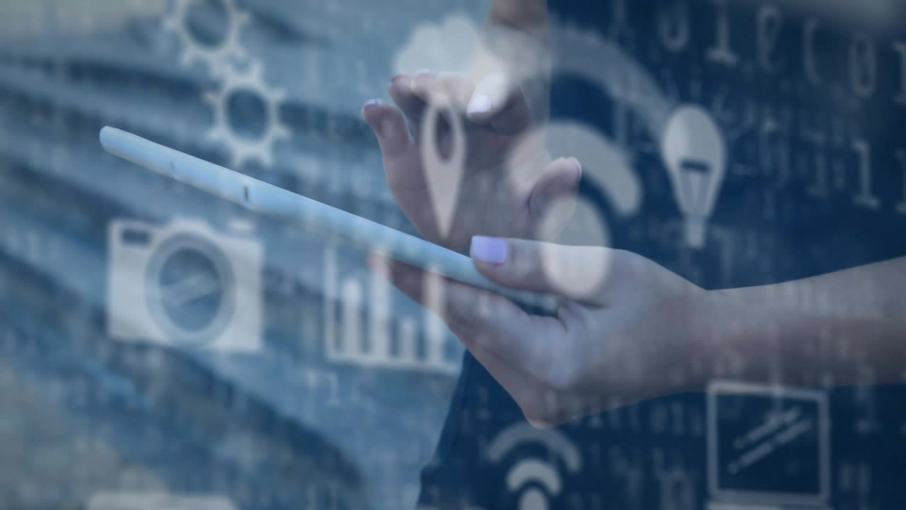 Woman's hands holding white tablet, tapping and swiping to access animated tech overlay icons