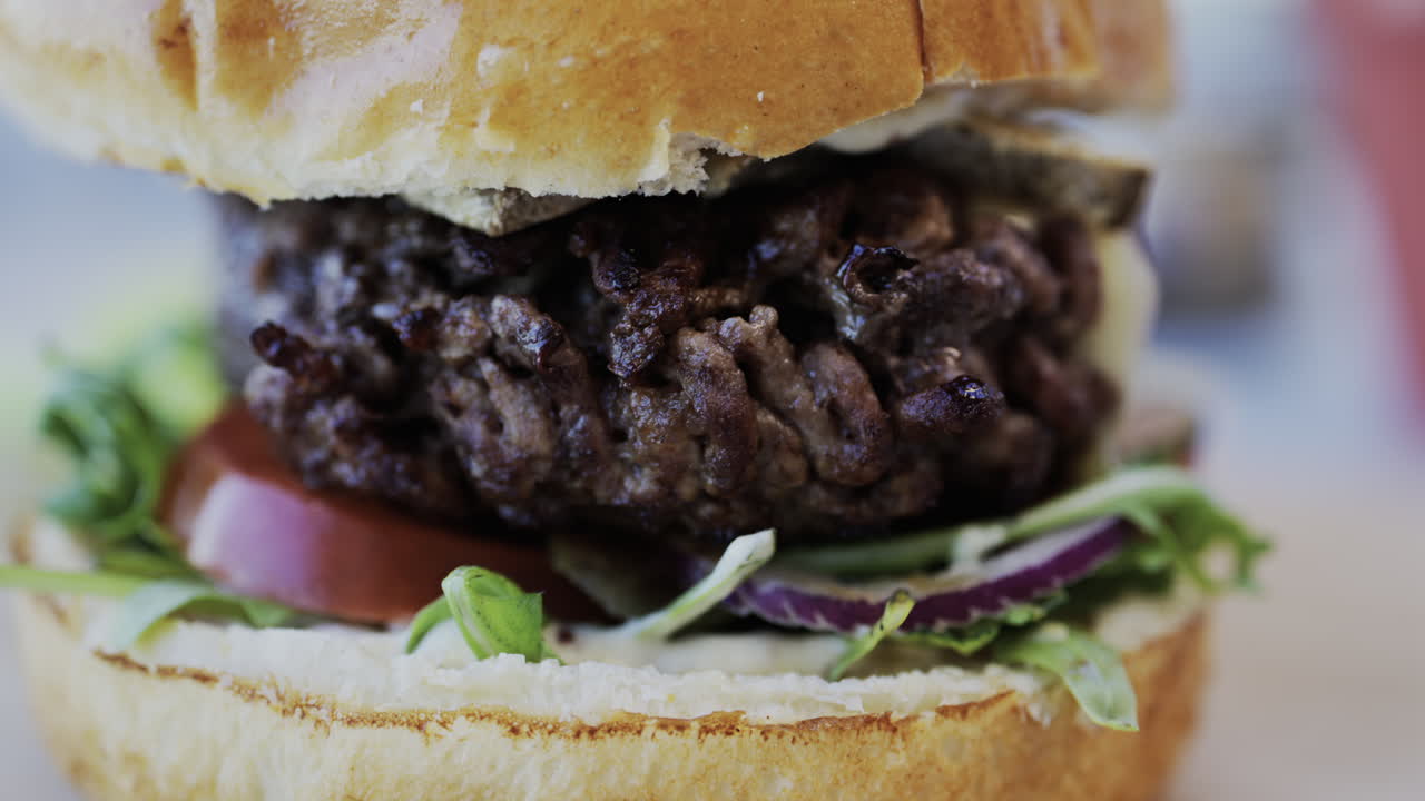 Close up of a hamburger on a plate at a restaurant