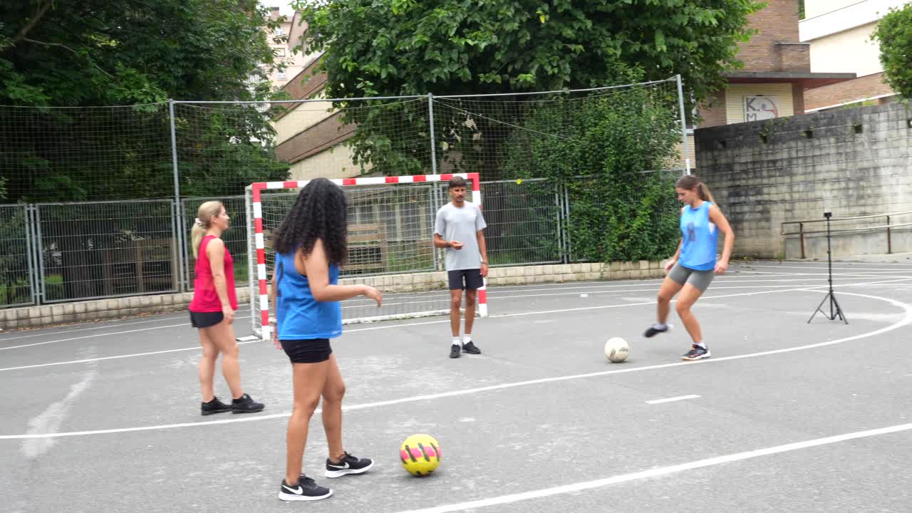 Group of young people playing soccer