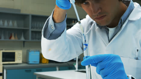 scientist doing chemical experiment