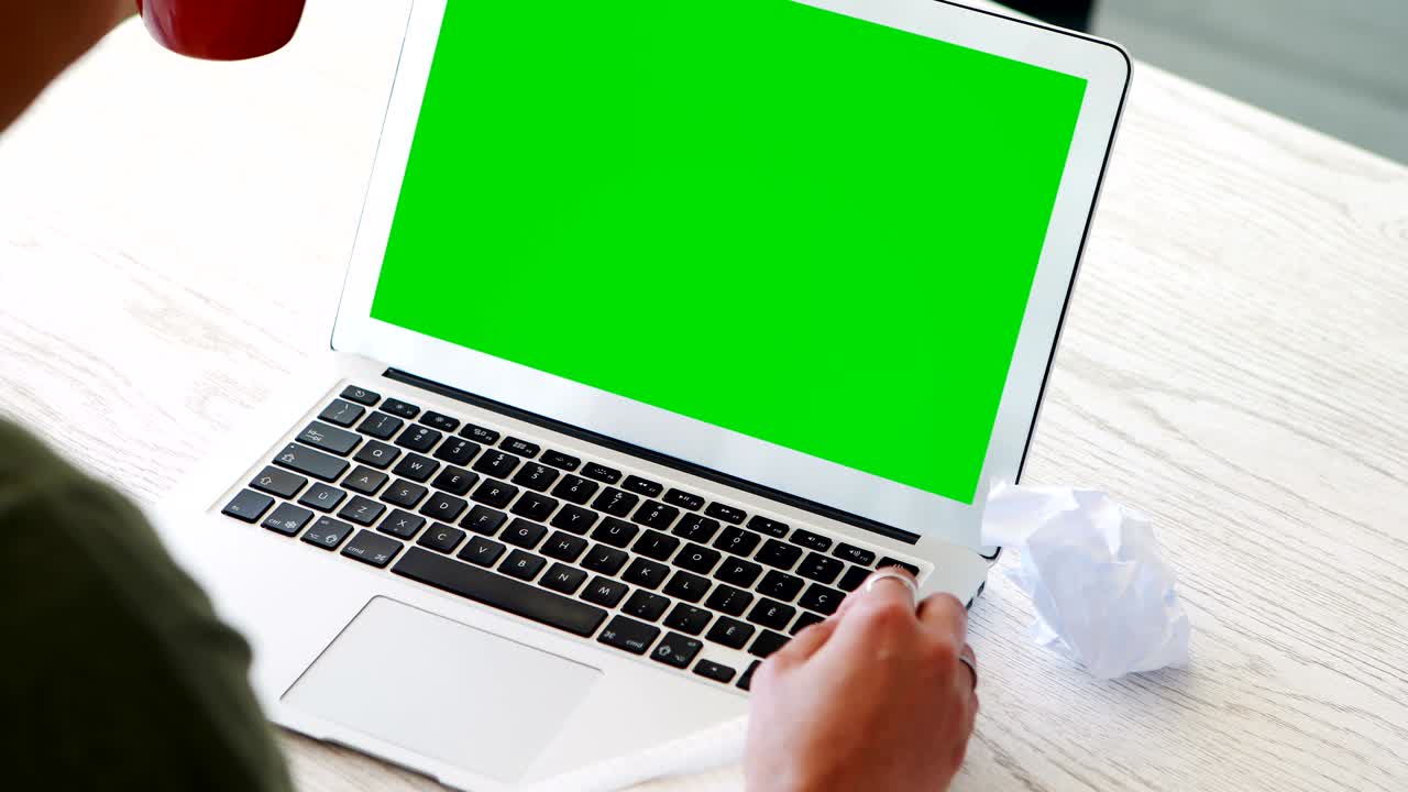 Female executive working on laptop while having coffee 4k