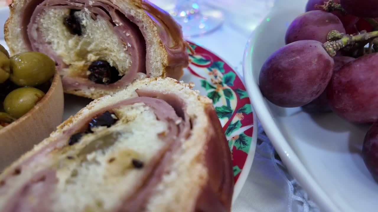 Fresh purple grapes on a plate with festive Christmas dinner elements