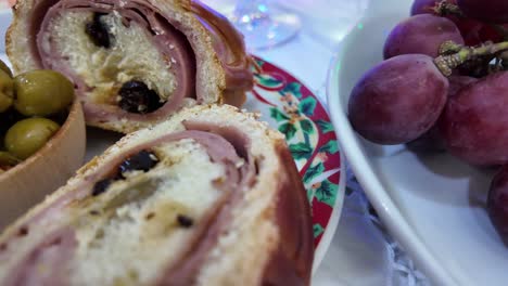 fresh purple grapes on a plate with festive christmas dinner elements