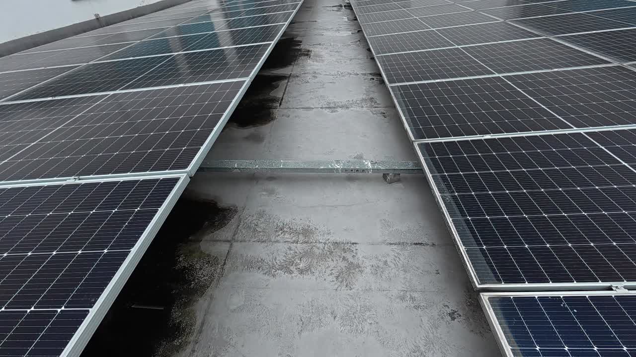Rows of solar panels installed on a rooftop absorb sunlight, converting it into clean electricity. This sustainable energy source promotes environmental efficiency and supports green living.