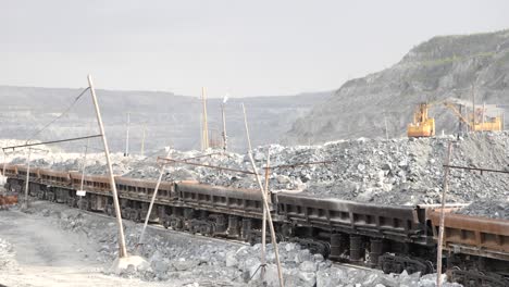 open-pit mine with train transporting ore