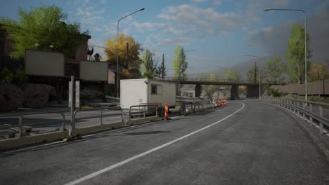 road under construction with workers and equipment near a bridge