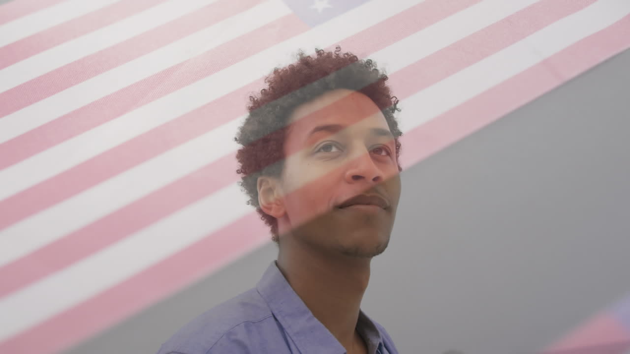 Animation of happy biracial man over flag of usa
