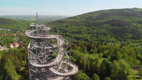 aerial orbit over the observation tower with stunning sudety mountains panorama