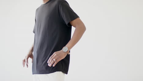 midsection of african american man wearing black t-shirt with copy space on white background