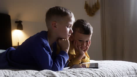 kids watching video on tablet