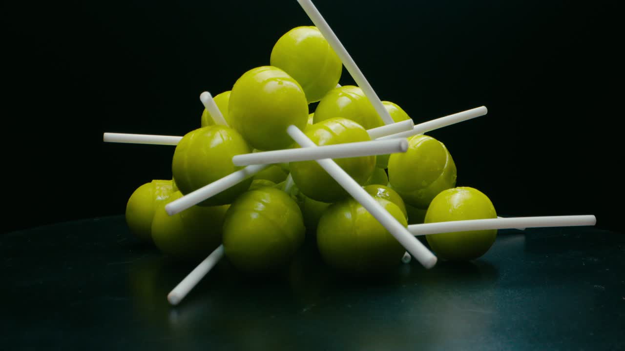 Green lollypop candies rotating. Broll detail shot.