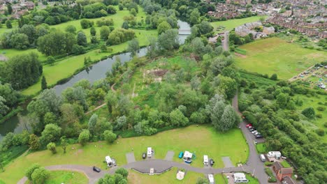 Aerial-view-of-Priory-Park-with-tourist-buses-parked-at-Huntingdonshire,-England