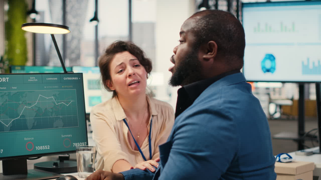Vertical Video Exasperated black manager dealing with a stressful situation at the office