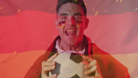 animation of confetti falling over caucasian footballer celebrating with german flag