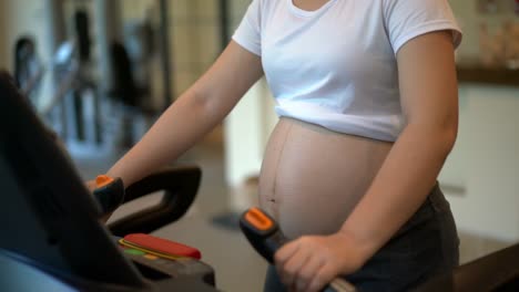 Active-pregnant-woman-exercise-in-fitness-center.