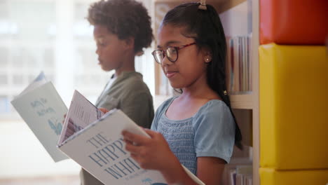 children reading books in a library