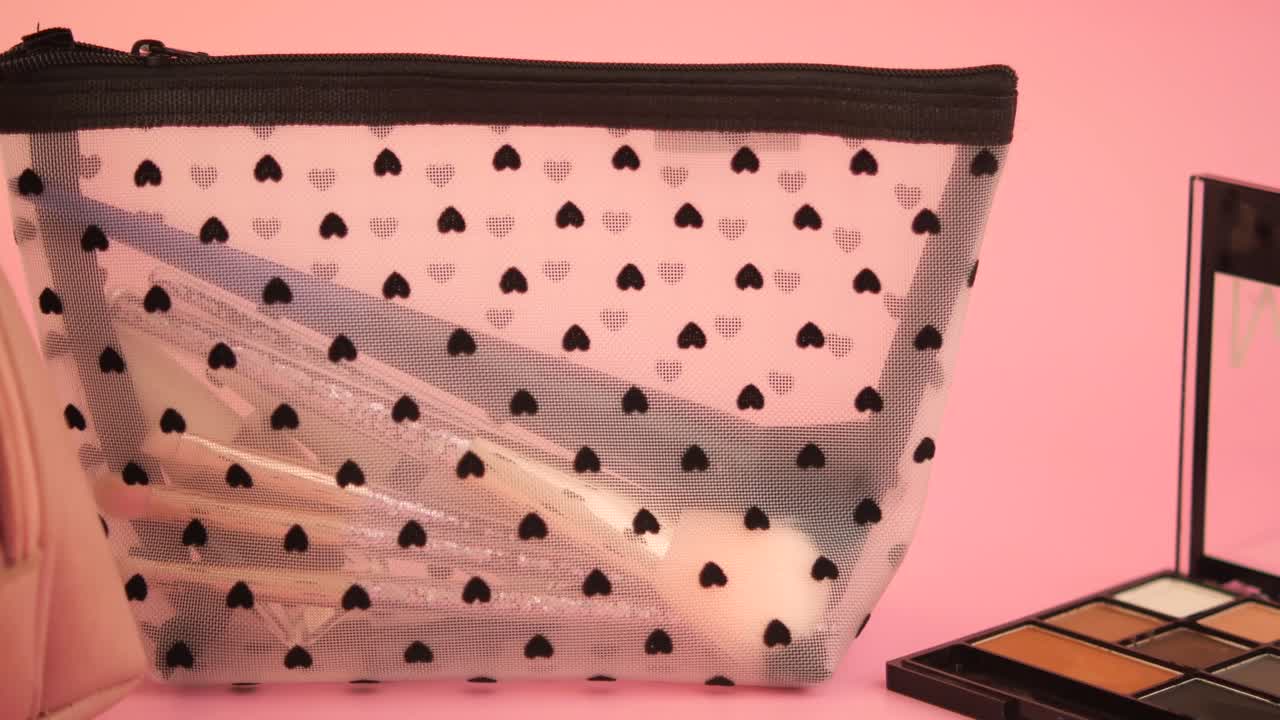 Cosmetic bag with makeup and brushes