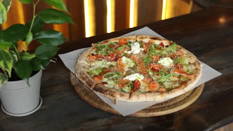 delicious salmon pizza on a wooden board