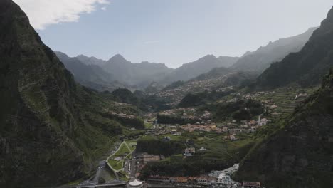 Birds-view-shot-of-a-cities-surrounded-by-mountains