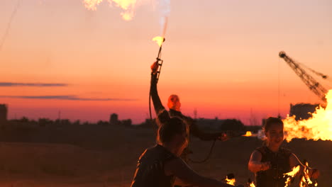 fire show artist breathe fire in the dark at abandon building slow motion. fire in heart shape.