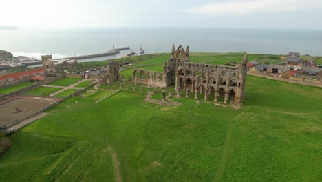 aerial view of whitby abbey with green lawn in north yorkshire, england, uk