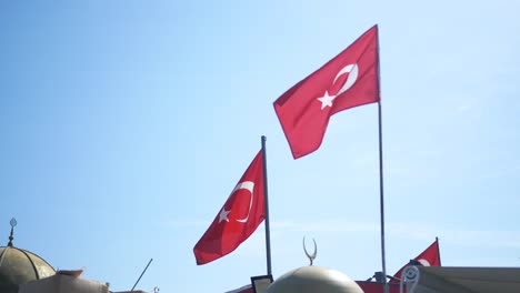 turkish flags waving in the blue sky