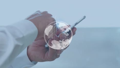 animation of globe over caucasian businessman using samrtphone