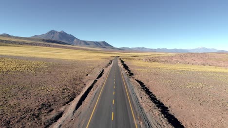 Aerial-cinematic-view-of-a-desert-road-in-Atacama
