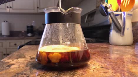 frothed cream being poured into coffee beaker in slow motion