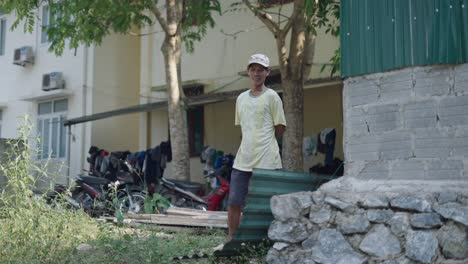 man standing in a yard
