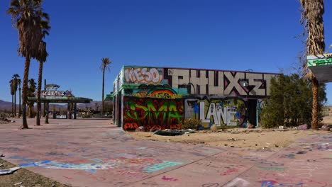 aerial push in on cool graffiti on vacant building