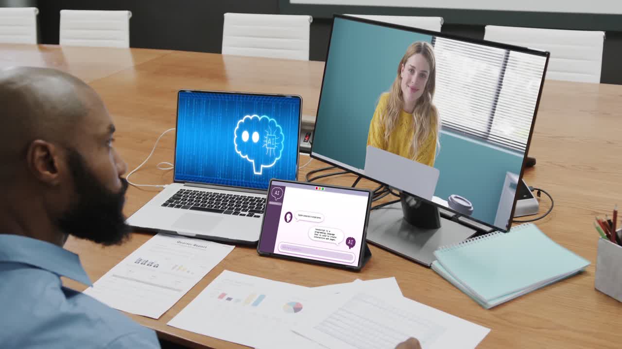 Diverse business people having video call and using technology with digital chat in office