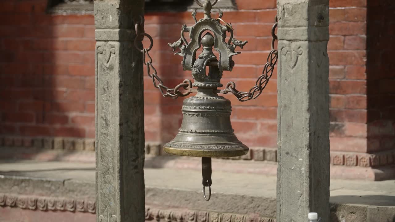 Prayer Bell at a Buddhist Temple in Nepal, Religious Site Architectural Details of a Large Metal Prayer Bell in Durbar Square in Kathmandu Old Historic City Centre, a Popular Tourist Landmark